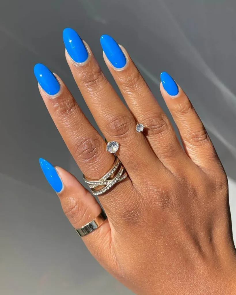 To me, this color is the flash of lightning during a late-night summer storm. To Miss Pop, it’s David Bowie in the song “Sound and Vision.” The bright, zingy blue is taking over this season with a bang. Miss Pop’s recommendation is Zoya Nail Polish in Walker, which she used on the models in BruceGlen’s spring/summer 2025 NYFW show to reflect the designer’s “dopamine dressing.