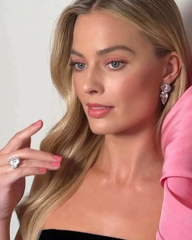 Sheer pastel-pink press-on nails with a jelly-like glossy finish, illustrating the translucent “jelly” mani trend