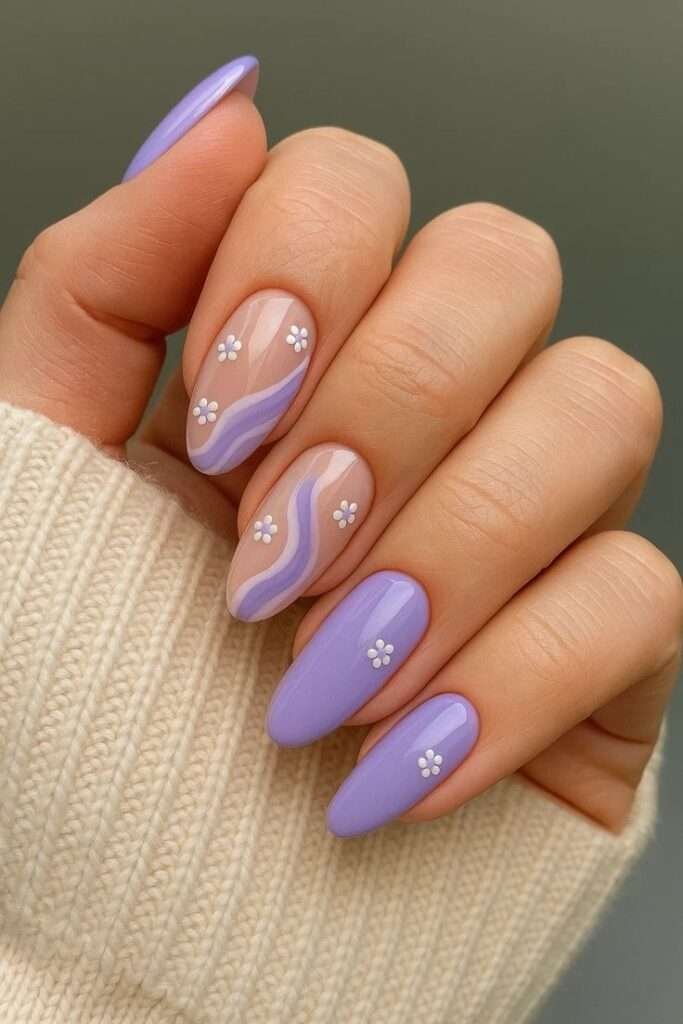 Pastels get playful this summer. Soft lilac, baby blue and mint green are “fresh and airy,” according to pros. Elle Gerstein says pastel lilac is her go-to summer shade – it “gives a soft shade with a lot of extra shine” and even plays neutral on olive skin. Wear them solid, or get creative with pastel swirl art or chromatic accents.