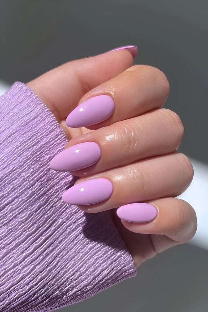 Pastels get playful this summer. Soft lilac, baby blue and mint green are “fresh and airy,” according to pros. Elle Gerstein says pastel lilac is her go-to summer shade – it “gives a soft shade with a lot of extra shine” and even plays neutral on olive skin. Wear them solid, or get creative with pastel swirl art or chromatic accents.