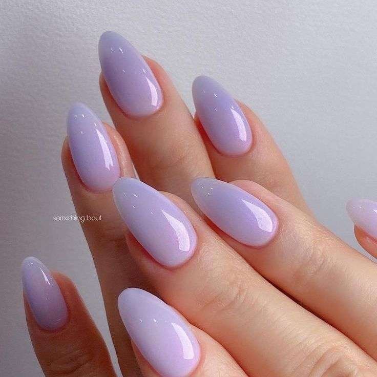 Pastels get playful this summer. Soft lilac, baby blue and mint green are “fresh and airy,” according to pros. Elle Gerstein says pastel lilac is her go-to summer shade – it “gives a soft shade with a lot of extra shine” and even plays neutral on olive skin. Wear them solid, or get creative with pastel swirl art or chromatic accents.