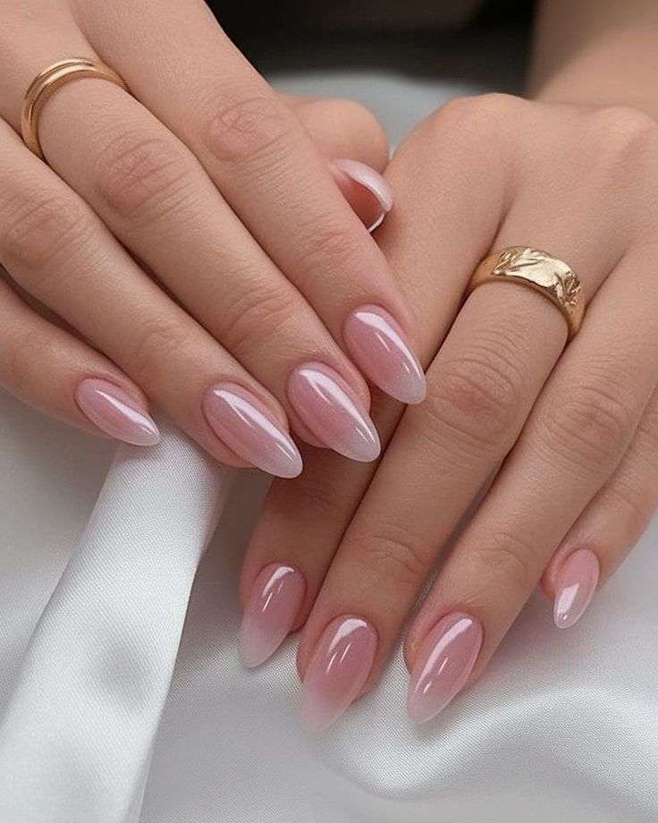 No matter the season, painting your nails pink is never a bad idea. This summer, Gerstein suggests ditching the classic color and using pearlescent pink polish instead. "This is replicating a shiny nail," she explains. "It’s like a micro shimmer, or it can have flecks of gold or silver." The glimmer effect adds a subtle pop to your manicure while still being minimalist.