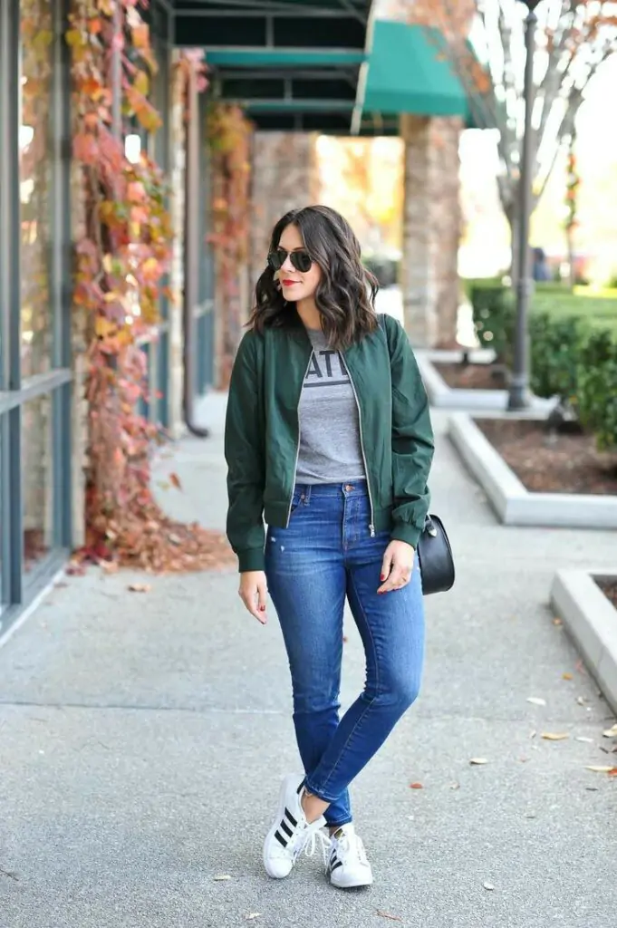 A campus classic that never goes out of style. The bomber jacket adds structure and edge. Sunglasses and sneakers seal the effortlessly cool look.