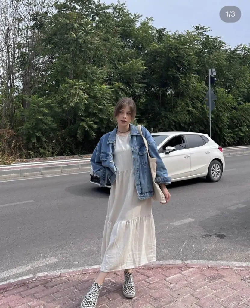 Layering at its finest — perfect for transitional weather. The denim jacket brings casual charm, while the dress keeps it feminine. Complete with ankle boots for a stylish finish.Layering at its finest — perfect for transitional weather. The denim jacket brings casual charm, while the dress keeps it feminine. Complete with ankle boots for a stylish finish.