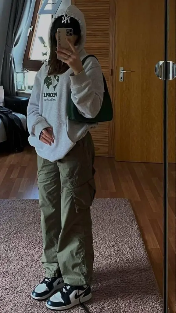 Functional yet fashion-forward, this pairing works for long study days. Cargo pants offer extra storage for essentials. Top it off with a baseball cap for a sporty edge.