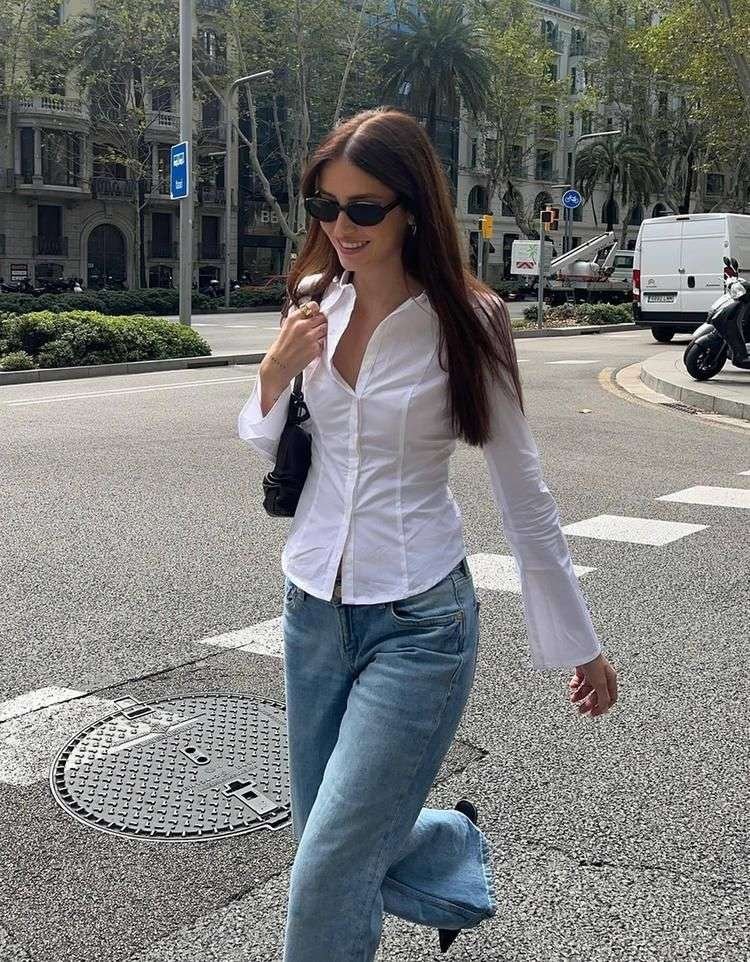 A minimalist’s dream outfit that works for class or coffee dates. The crisp white shirt adds structure, while slim pants elongate your frame. Add a leather watch for subtle elegance.