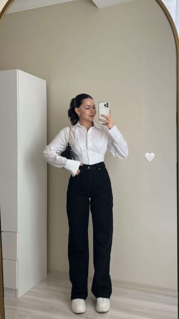 A minimalist’s dream outfit that works for class or coffee dates. The crisp white shirt adds structure, while slim pants elongate your frame. Add a leather watch for subtle elegance.