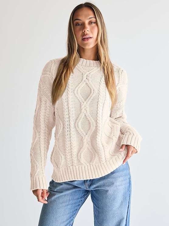 Nothing says fall like a chunky oversized sweater that feels as cozy as it looks. Pair it with skinny jeans or layer it over a satin skirt for that effortless 2025 street style vibe.