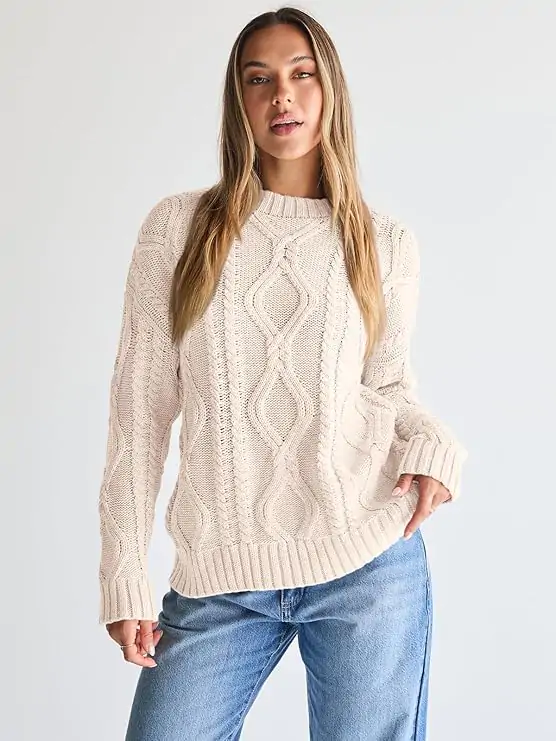 Nothing says fall like a chunky oversized sweater that feels as cozy as it looks. Pair it with skinny jeans or layer it over a satin skirt for that effortless 2025 street style vibe.