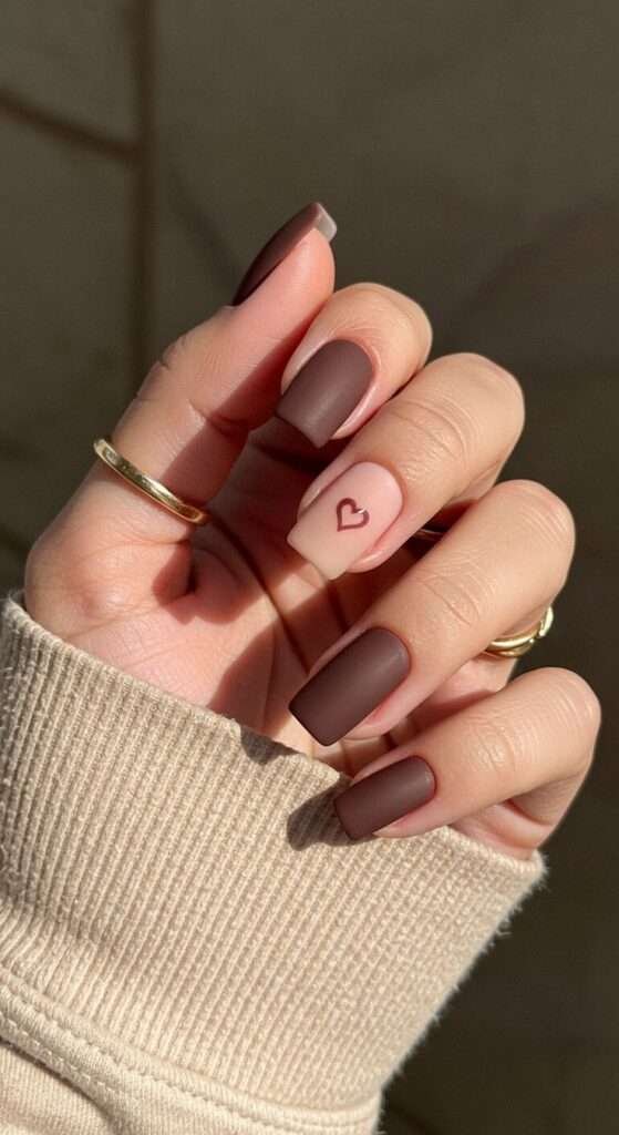 Matte nude + heart contrast nails