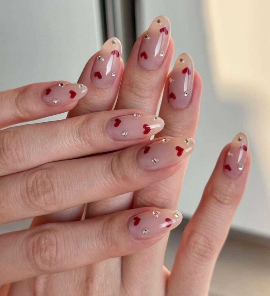 Pearl-style minimal charms Valentine nail ideas