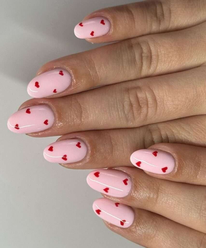 Tiny hand-painted hearts Valentine nail ideas