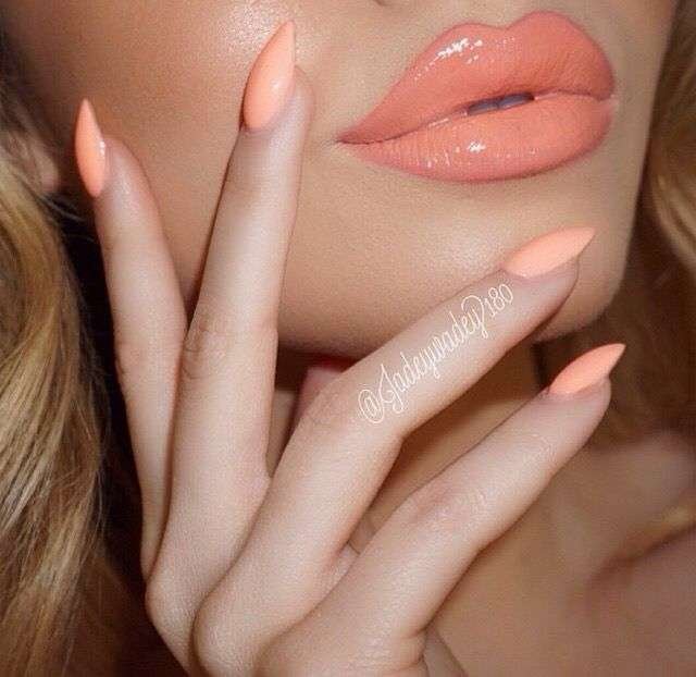 This sophisticated look is widely known as a Peach French Tip Manicure on an Almond shape. In 2026, this specific minimalist style is often called "American French" or "Vanilla Nails" when the contrast between the base and tip is soft and natural rather than stark white.