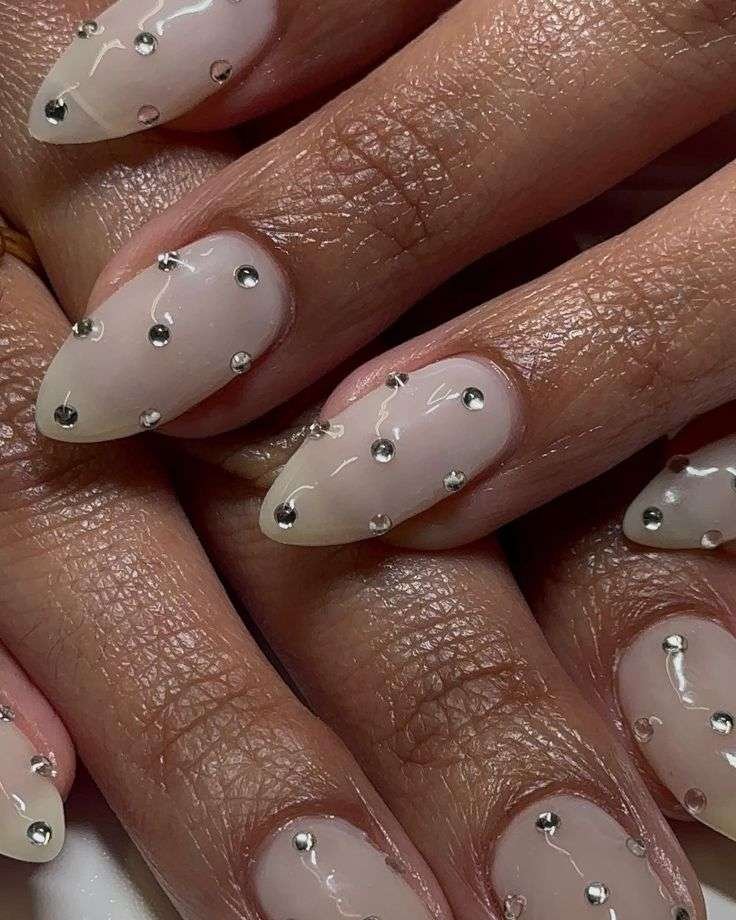 This vibrant and playful look is most commonly referred to as Mismatched Pink and White Polka Dot nails. In the 2026 nail scene, this specific aesthetic—featuring a "Skittle" palette of different pinks—is also a major part of the "Barbiecore" or "Coquette" nail trends, which emphasize hyper-feminine, vintage-inspired details.