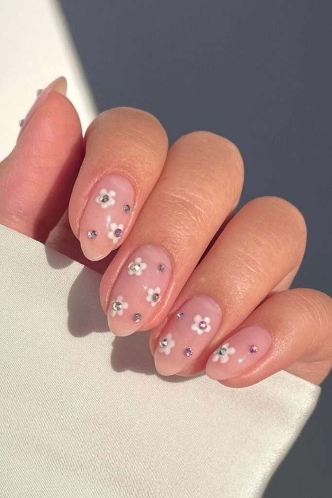 This vibrant and playful look is most commonly referred to as Mismatched Pink and White Polka Dot nails. In the 2026 nail scene, this specific aesthetic—featuring a "Skittle" palette of different pinks—is also a major part of the "Barbiecore" or "Coquette" nail trends, which emphasize hyper-feminine, vintage-inspired details.