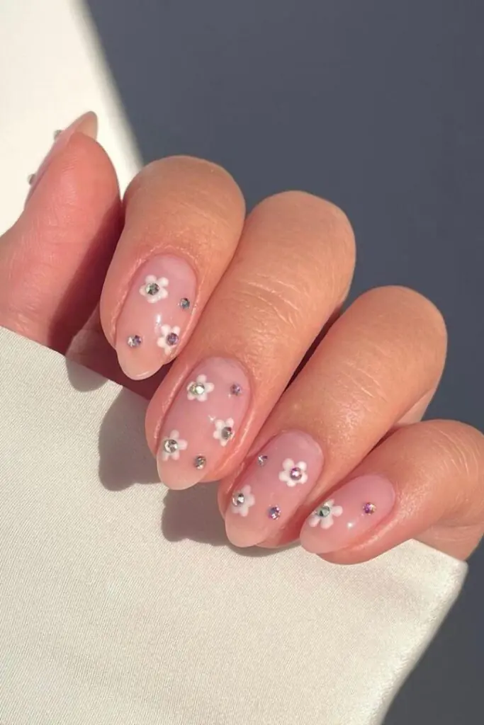 This vibrant and playful look is most commonly referred to as Mismatched Pink and White Polka Dot nails. In the 2026 nail scene, this specific aesthetic—featuring a "Skittle" palette of different pinks—is also a major part of the "Barbiecore" or "Coquette" nail trends, which emphasize hyper-feminine, vintage-inspired details.