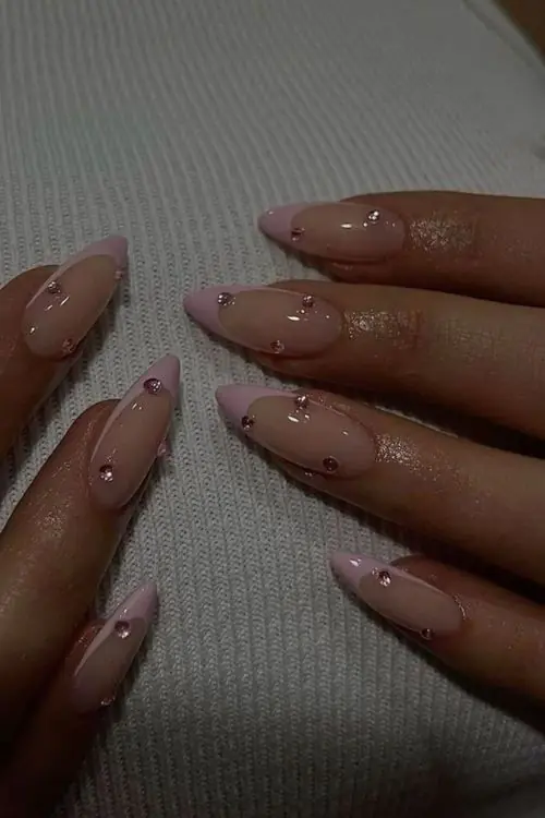 This vibrant and playful look is most commonly referred to as Mismatched Pink and White Polka Dot nails. In the 2026 nail scene, this specific aesthetic—featuring a "Skittle" palette of different pinks—is also a major part of the "Barbiecore" or "Coquette" nail trends, which emphasize hyper-feminine, vintage-inspired details.