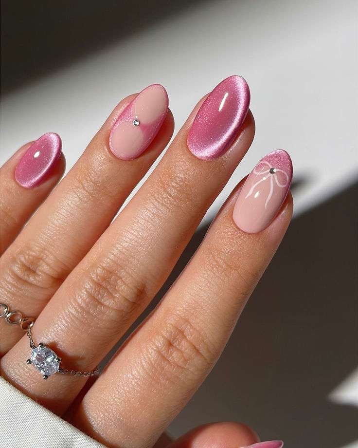 This specific nail art style is most commonly referred to as Pink Velvet Cat Eye nails with Bows. It blends several trendy aesthetics from 2025 and 2026, primarily categorized under the "Coquette" or "Princess" nail trends.