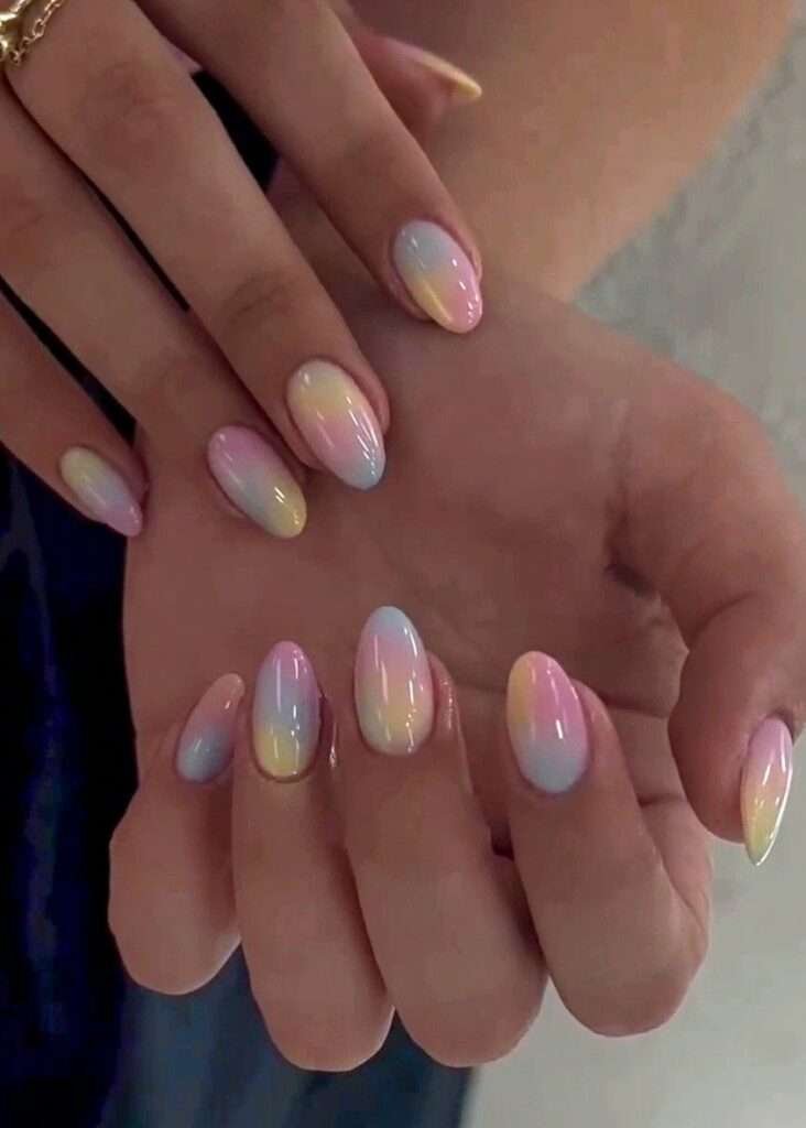 This vibrant and artistic nail style is most commonly referred to as Abstract Watercolor nails or Aura Ink nails. In the 2026 beauty scene, this specific look—featuring soft, bleeding colors on a semi-translucent background—is also being dubbed "Nuance nails". This trend, originating from Japan and Korea, focuses on "gossamer" colors
