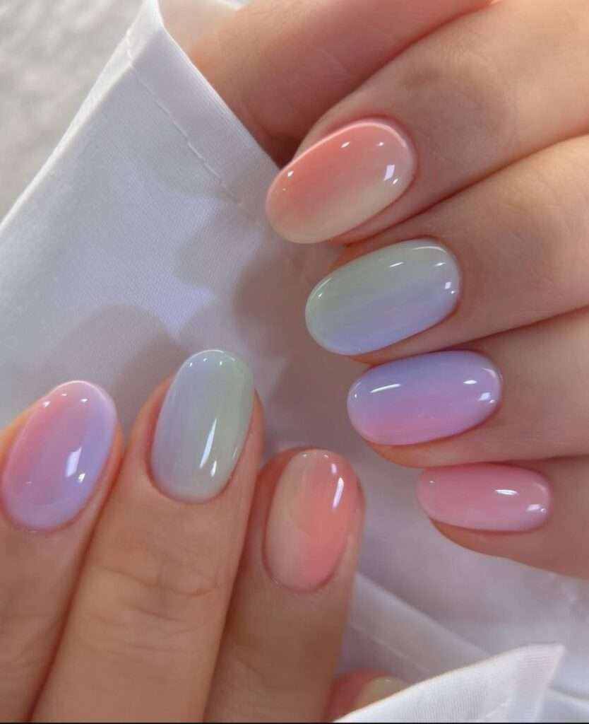 This vibrant and artistic nail style is most commonly referred to as Abstract Watercolor nails or Aura Ink nails. In the 2026 beauty scene, this specific look—featuring soft, bleeding colors on a semi-translucent background—is also being dubbed "Nuance nails". This trend, originating from Japan and Korea, focuses on "gossamer" colors