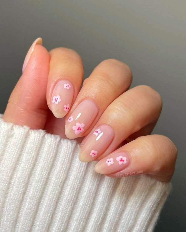 This graceful, clean look is most commonly referred to as Cherry Blossom Minimalist nails or Dainty Floral Almond nails. In the 2026 beauty scene, this specific aesthetic is also categorized under the "Rich Girl" or "Soft Girl" nail trends, which prioritize clean, polished simplicity with subtle, hand-painted details.