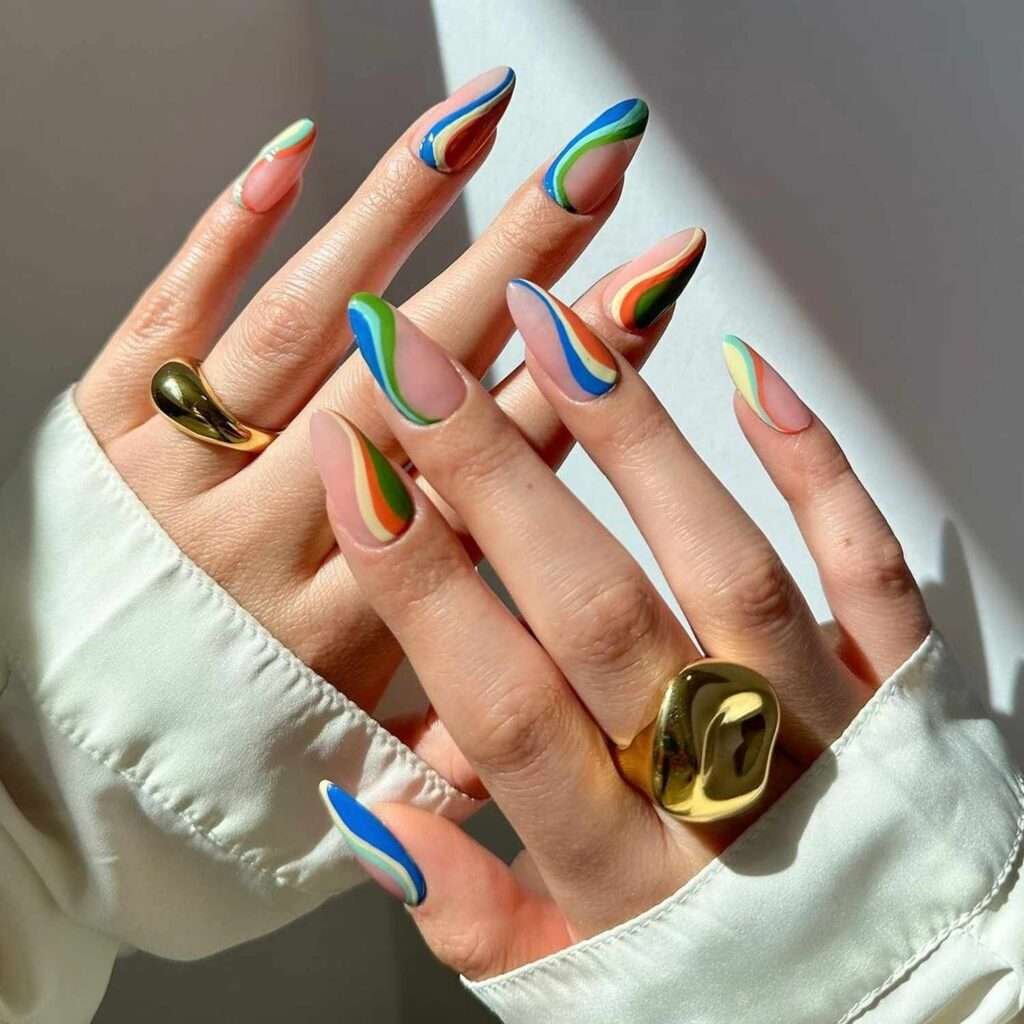 Abstract swirl nail art is a versatile and evergreen trend that emphasizes fluid, organic lines and playful color layering. For 2026, the trend has evolved into "soft maximalism," combining retro 90s-inspired curves with modern finishes like chrome accents and cat-eye magnetic effects.