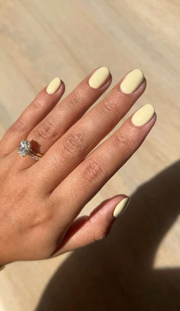 Butter yellow nails are the "it" manicure color for 2026, characterized by a soft, creamy pastel hue that sits between bright lemon and warm vanilla. This trend is frequently described as a "new neutral" because its muted, milky undertones are universally flattering and pair easily with almost any outfit.