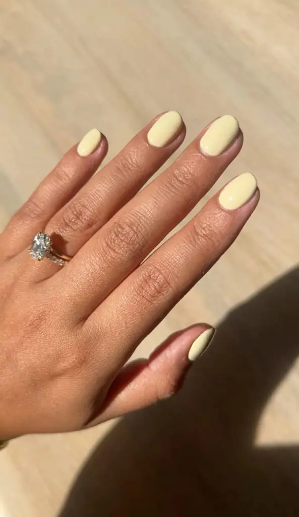 Butter yellow nails are the "it" manicure color for 2026, characterized by a soft, creamy pastel hue that sits between bright lemon and warm vanilla. This trend is frequently described as a "new neutral" because its muted, milky undertones are universally flattering and pair easily with almost any outfit.