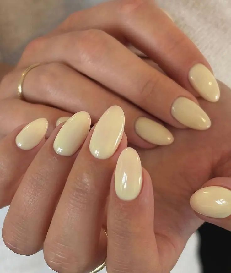 Butter yellow nails are the "it" manicure color for 2026, characterized by a soft, creamy pastel hue that sits between bright lemon and warm vanilla. This trend is frequently described as a "new neutral" because its muted, milky undertones are universally flattering and pair easily with almost any outfit.