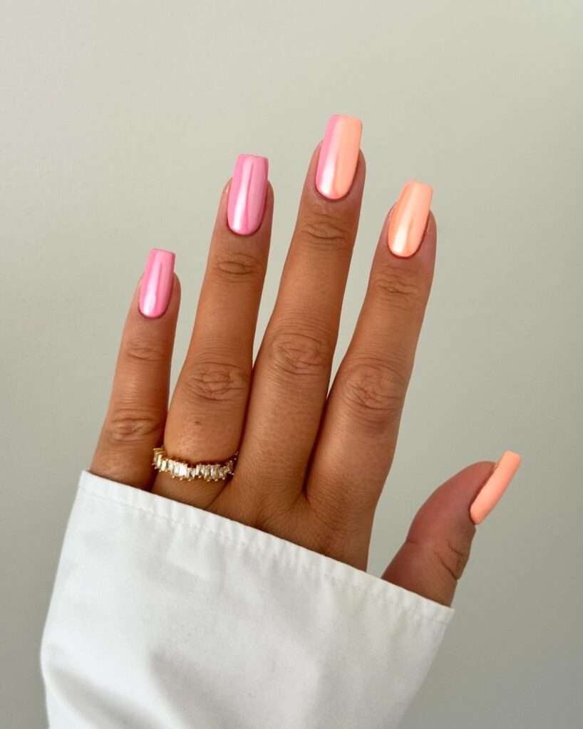 Coral chrome glazed nails are a vibrant, high-shine manicure trend that combines the citrusy warmth of orange with soft pink undertones, finished with a reflective. This style is often referred to as "sunset glazed" or "apricot chrome," offering a modern update to the classic "glazed donut" look popularized by Hailey Bieber