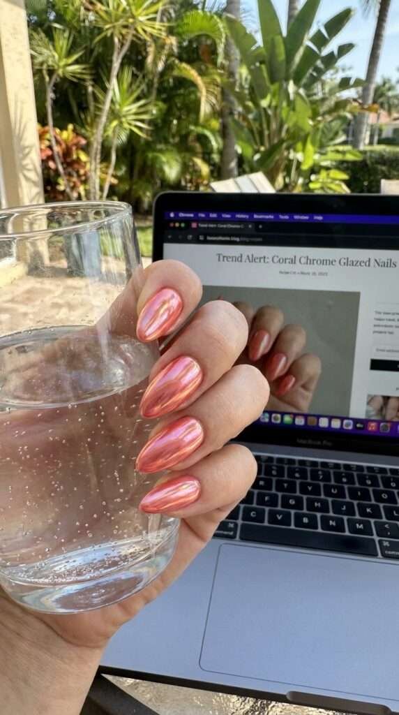 Coral chrome glazed nails are a vibrant, high-shine manicure trend that combines the citrusy warmth of orange with soft pink undertones, finished with a reflective. This style is often referred to as "sunset glazed" or "apricot chrome," offering a modern update to the classic "glazed donut" look popularized by Hailey Bieber