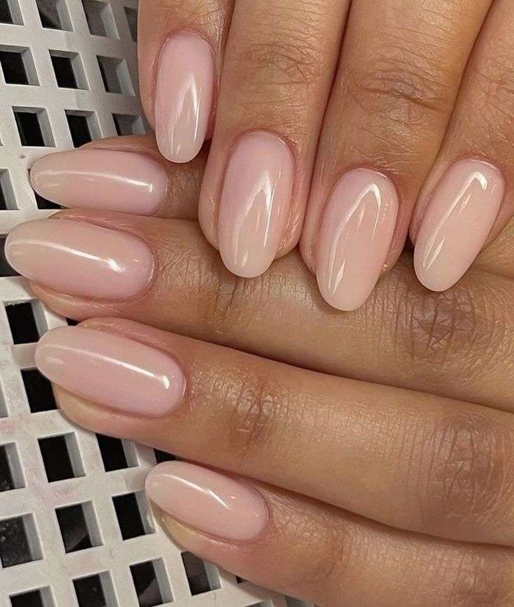 Linen nude nails are a prominent "quiet luxury" trend characterized by a creamy, neutral shade that sits between a stark white and a warm nude, mimicking the look of high-quality linen fabric. 