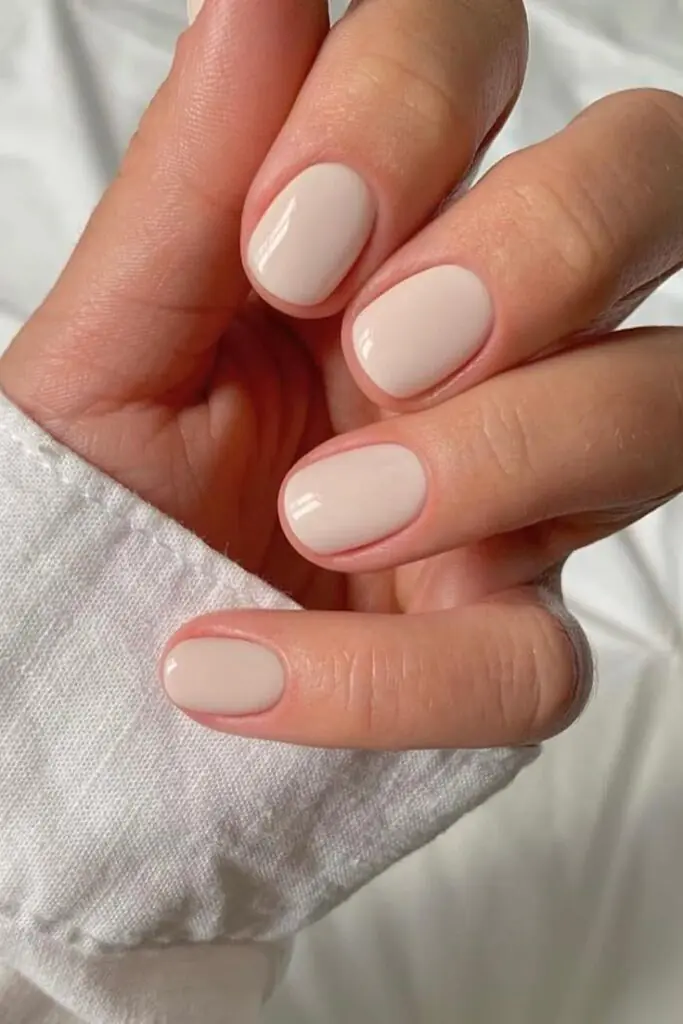 Linen nude nails are a prominent "quiet luxury" trend characterized by a creamy, neutral shade that sits between a stark white and a warm nude, mimicking the look of high-quality linen fabric.