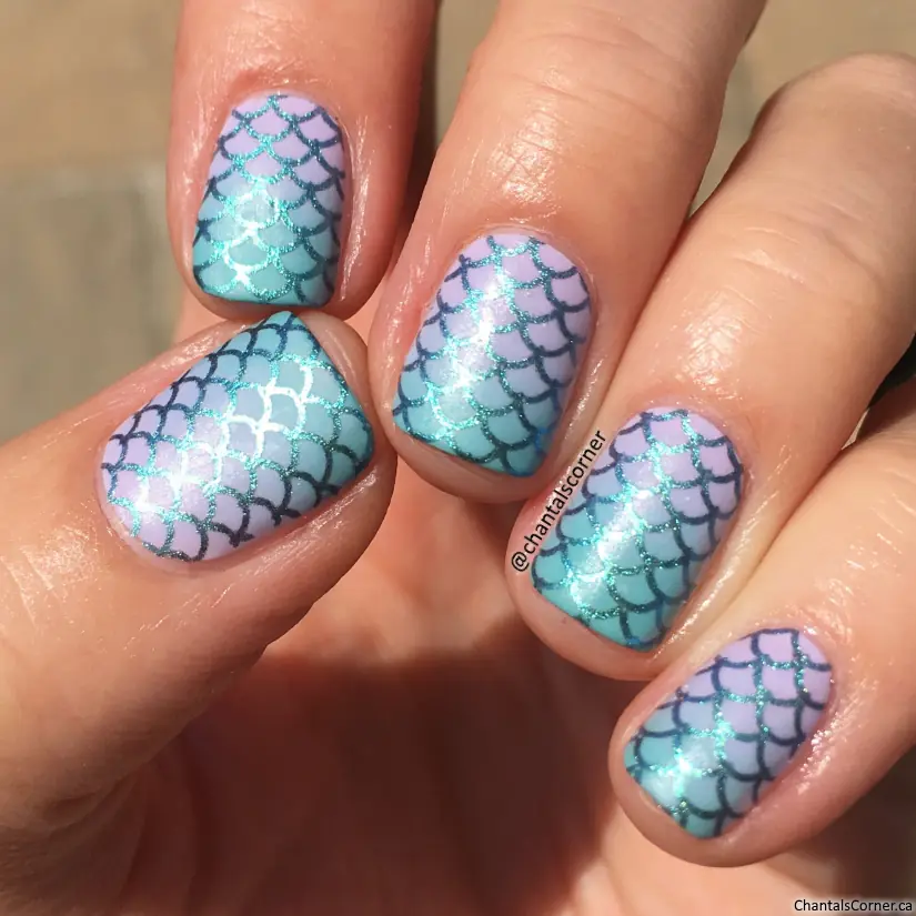 Mermaid scale nails are a whimsical, ocean-inspired manicure trend that mimics the overlapping, shimmering patterns of a mythical siren's tail. This aesthetic centers on iridescent, metallic, and holographic finishes in shades of seafoam green, aquamarine, and deep purple. In 2026, the trend has evolved toward "softer maximalism," featuring ultra-sheer glitter gels and refined 3D textures that feel airy and elegant.