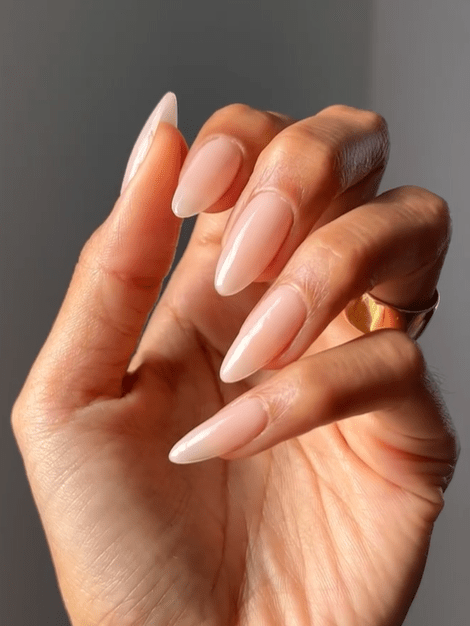 Linen nude nails are a prominent "quiet luxury" trend characterized by a creamy, neutral shade that sits between a stark white and a warm nude, mimicking the look of high-quality linen fabric. 
