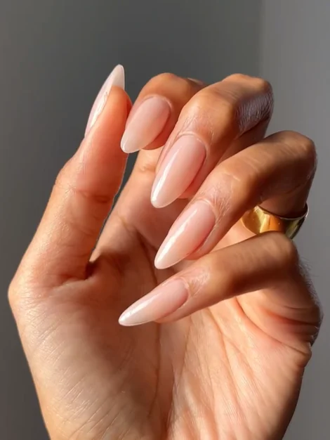 Linen nude nails are a prominent "quiet luxury" trend characterized by a creamy, neutral shade that sits between a stark white and a warm nude, mimicking the look of high-quality linen fabric.