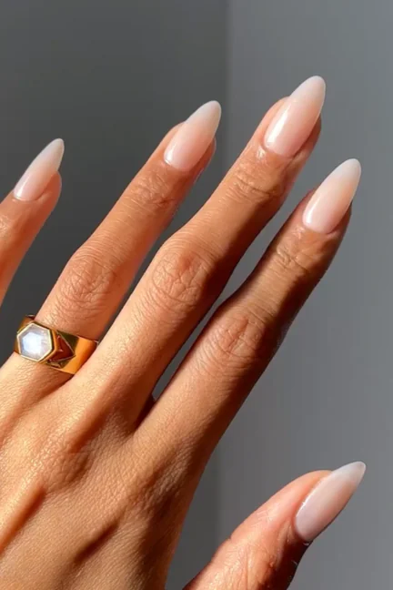 Linen nude nails are a prominent "quiet luxury" trend characterized by a creamy, neutral shade that sits between a stark white and a warm nude, mimicking the look of high-quality linen fabric.