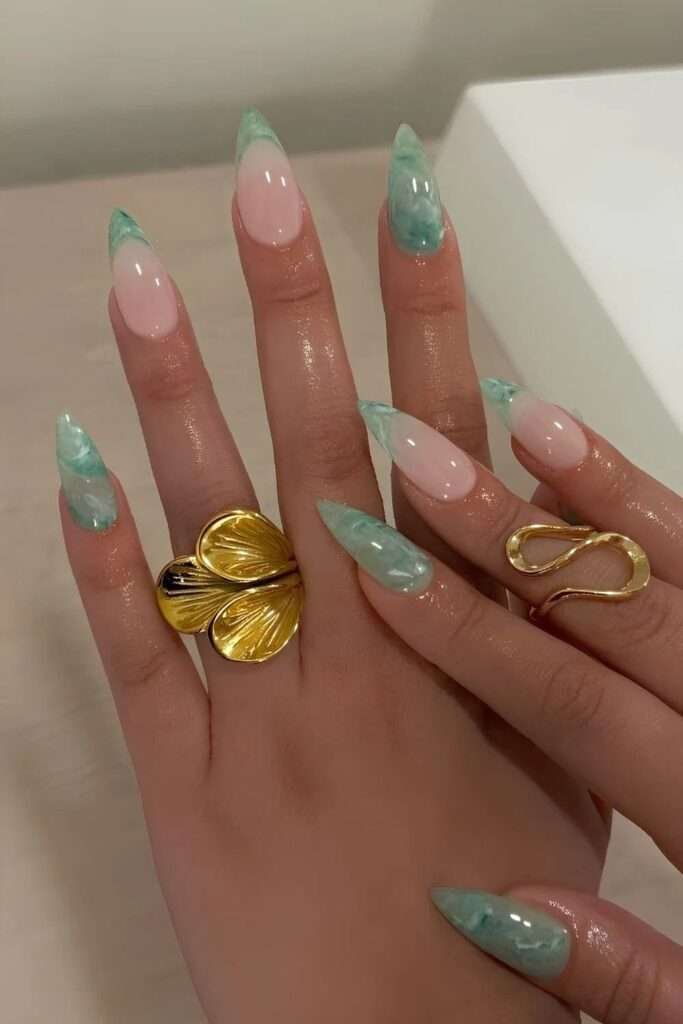 Sea glass nails are a soft, translucent manicure trend that mimics the frosted, matte texture of glass shards found along the shoreline. Often described as the "matte older sister" of jelly nails, this aesthetic swaps high-shine finishes for a sea-weathered, opaque look. 