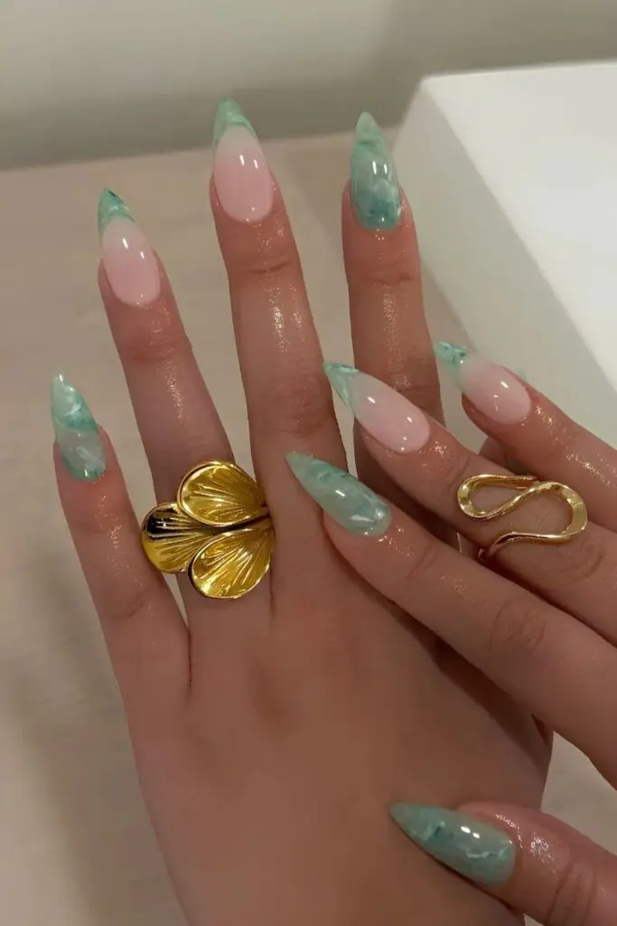 Sea glass nails are a soft, translucent manicure trend that mimics the frosted, matte texture of glass shards found along the shoreline. Often described as the "matte older sister" of jelly nails, this aesthetic swaps high-shine finishes for a sea-weathered, opaque look.