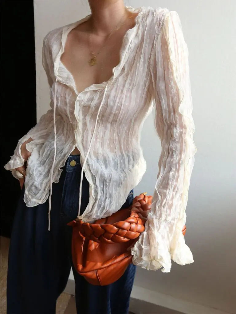 Sheer fashion has been circling for a few seasons, but Summer 2026 is where it finally becomes wearable for real life. Stella McCartney and Tom Ford led the charge with lingerie-inspired sheer at their Spring/Summer 2026 shows — but the way the style world is actually wearing it has nothing to do with barely-there dressing.