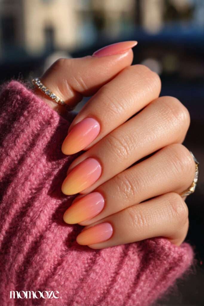Sunset ombré nails are a vibrant summer trend that captures the warm, glowing hues of the evening sky. This style typically features a seamless gradient of pink, orange, and golden yellow, often accented with silhouettes of palm trees or fine glitter for a "golden hour" effect. In 2026, the trend has shifted toward softer, modern gradients using sheer bases and milky tones for a cleaner, dimensional look. 