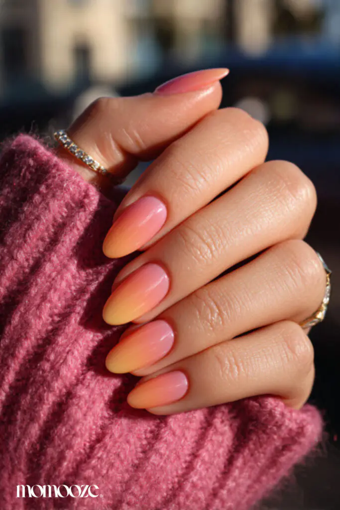 Sunset ombré nails are a vibrant summer trend that captures the warm, glowing hues of the evening sky. This style typically features a seamless gradient of pink, orange, and golden yellow, often accented with silhouettes of palm trees or fine glitter for a "golden hour" effect. In 2026, the trend has shifted toward softer, modern gradients using sheer bases and milky tones for a cleaner, dimensional look.