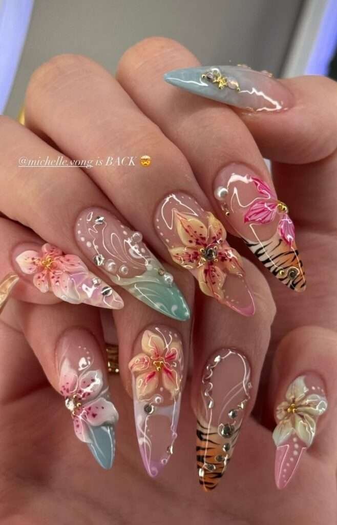 Tropical floral nail art is a vibrant manicure trend that captures the essence of a sun-soaked getaway using exotic motifs like hibiscus flowers, palm leaves, and monstera plants. This aesthetic often features neon or bright tropical colors that pop in direct sunlight, such as fuchsia, tangerine, and turquoise