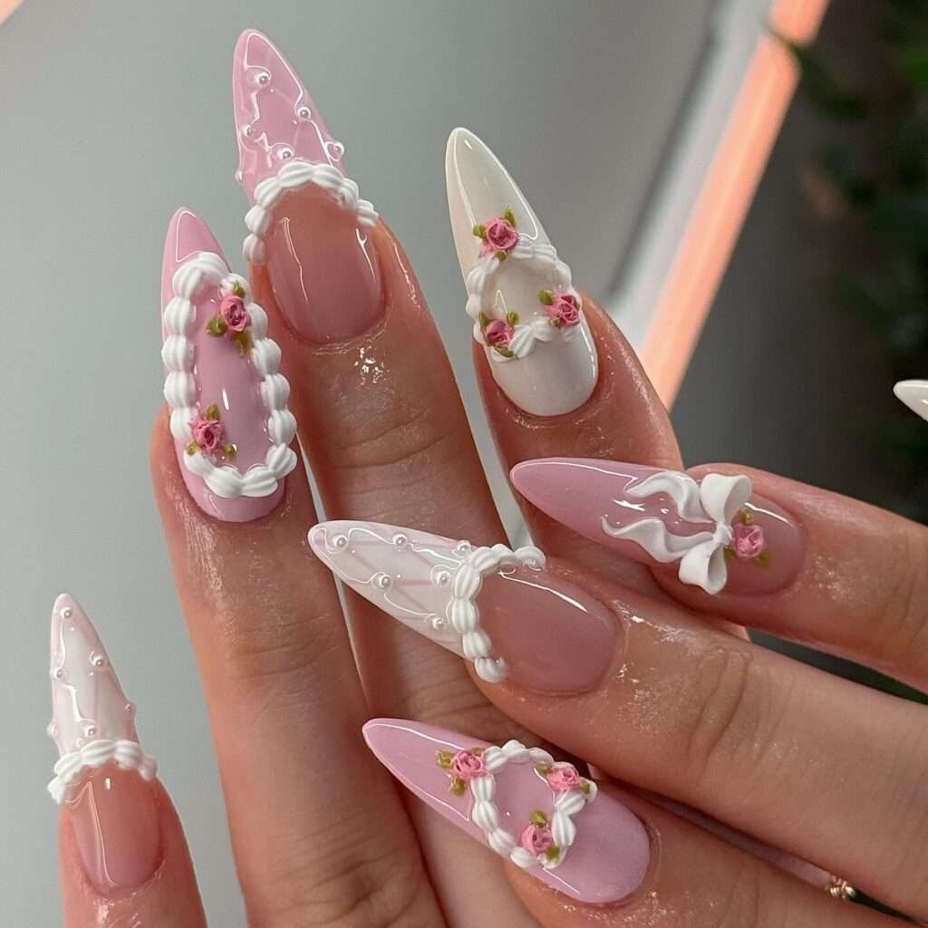 Coquette bow nails are the pinnacle of the "balletcore" and "soft girl" aesthetics, featuring delicate, hyper-feminine details like 3D ribbons, pearls, and lace patterns. This 2026 trend focuses on a "pretty in pink" palette, often utilizing sheer jelly bases to keep the look light and ethereal. 