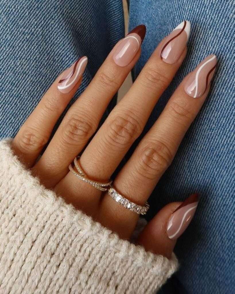 Abstract swirl nail art is a versatile and evergreen trend that emphasizes fluid, organic lines and playful color layering. For 2026, the trend has evolved into "soft maximalism," combining retro 90s-inspired curves with modern finishes like chrome accents and cat-eye magnetic effects.