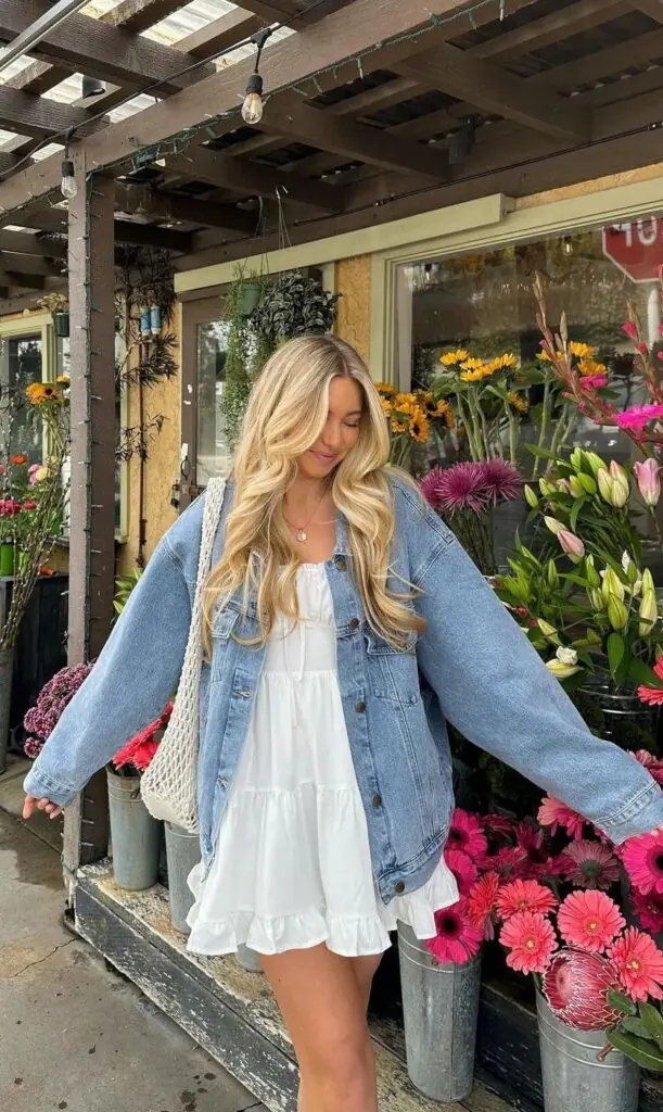 They always say denim is forever — and they're right. Layer a cropped denim jacket over a floral mini dress for that perfect "effortlessly put together" energy. 