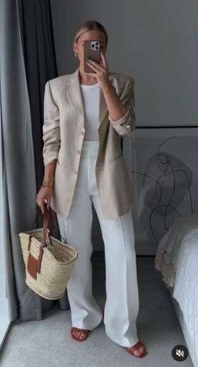 For those who love a clean, elevated aesthetic, the neutral power suit is the summer 2026 uniform of choice. Beige straight-leg trousers with an oversized white linen blazer (sleeves pushed up casually) is everything you need for summer work days, outdoor events, and smart casual dinners. Pair with cream loafers and a sleek black bag to complete the look.