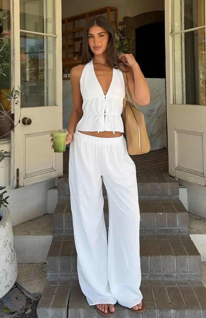 Earth tones are one of the biggest summer 2026 trends, and terracotta is the queen of them all. A fitted terracotta knit top paired with flowy wide-leg linen pants in the same warm palette looks incredibly sophisticated.