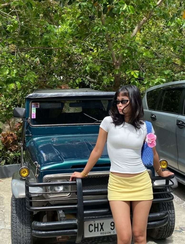 Summer 2026 is bringing back the Y2K micro mini — and we are so here for it. Pair a bright lemon yellow mini skirt with a fitted white crop top, platform sandals, and tiny tinted sunglasses.
