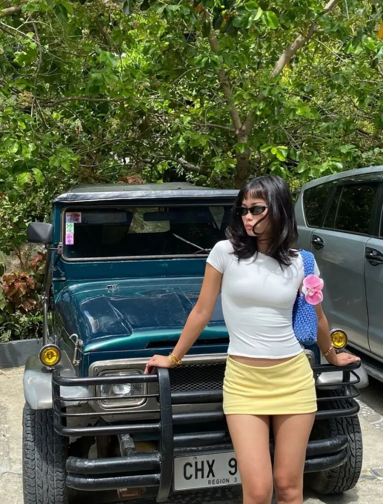 Summer 2026 is bringing back the Y2K micro mini — and we are so here for it. Pair a bright lemon yellow mini skirt with a fitted white crop top, platform sandals, and tiny tinted sunglasses.